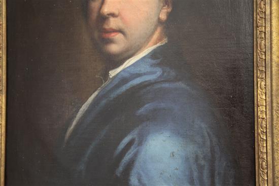 Early 18th century English School Portrait of a gentleman wearing a blue coat, 23.5 x 17.5in.